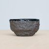 Stone Age black tea cup